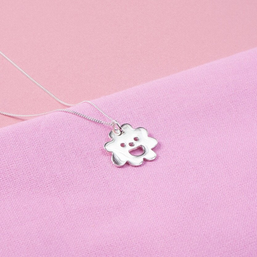 Close up of silver Smiley Flower Necklace