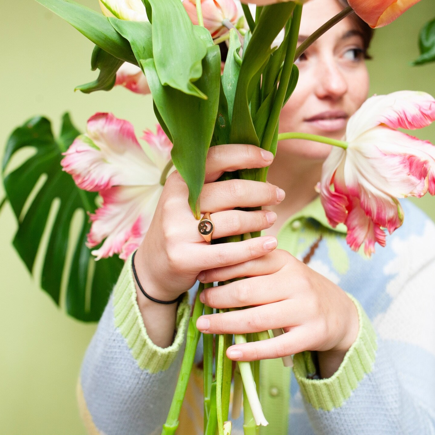 Woman wearing gold Smiley Signet Ring