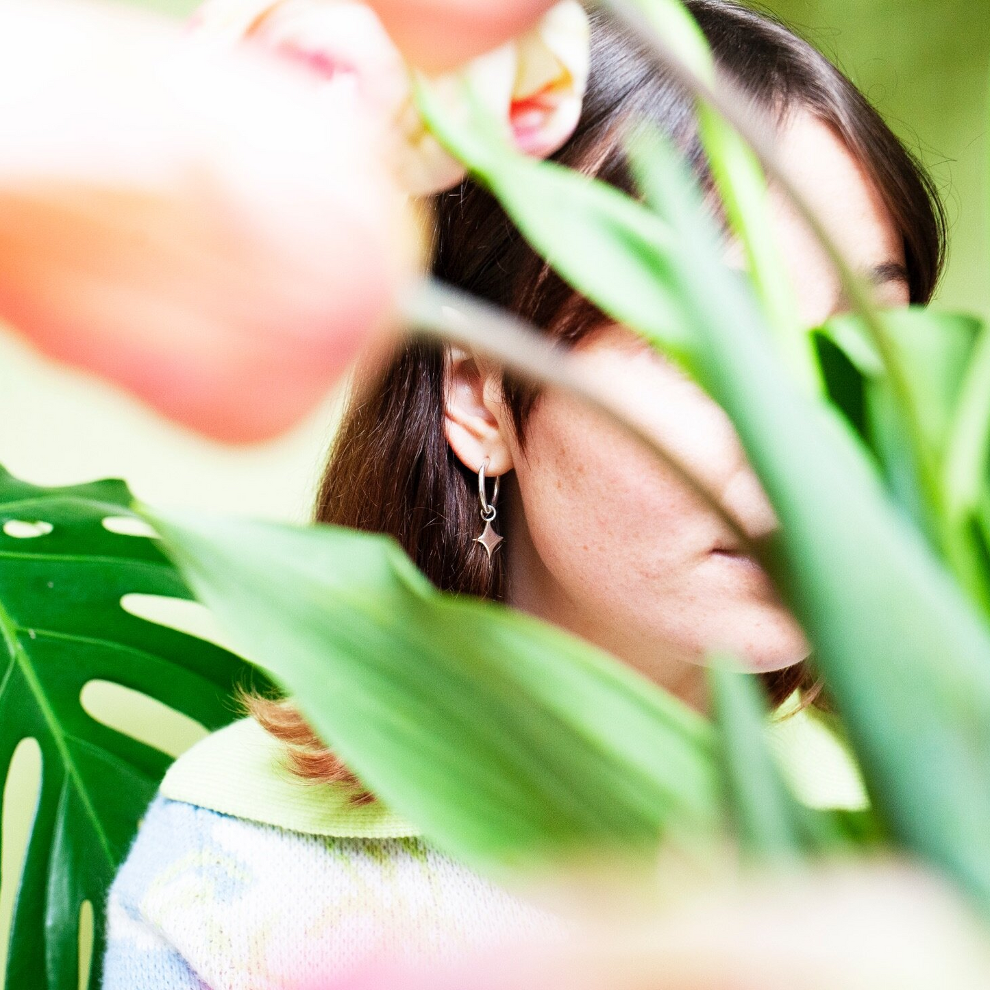 Small hoop earrings with a star shaped charm