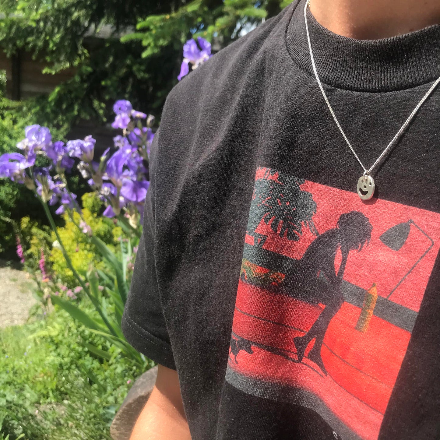 Person wearing silver Smiley Necklace