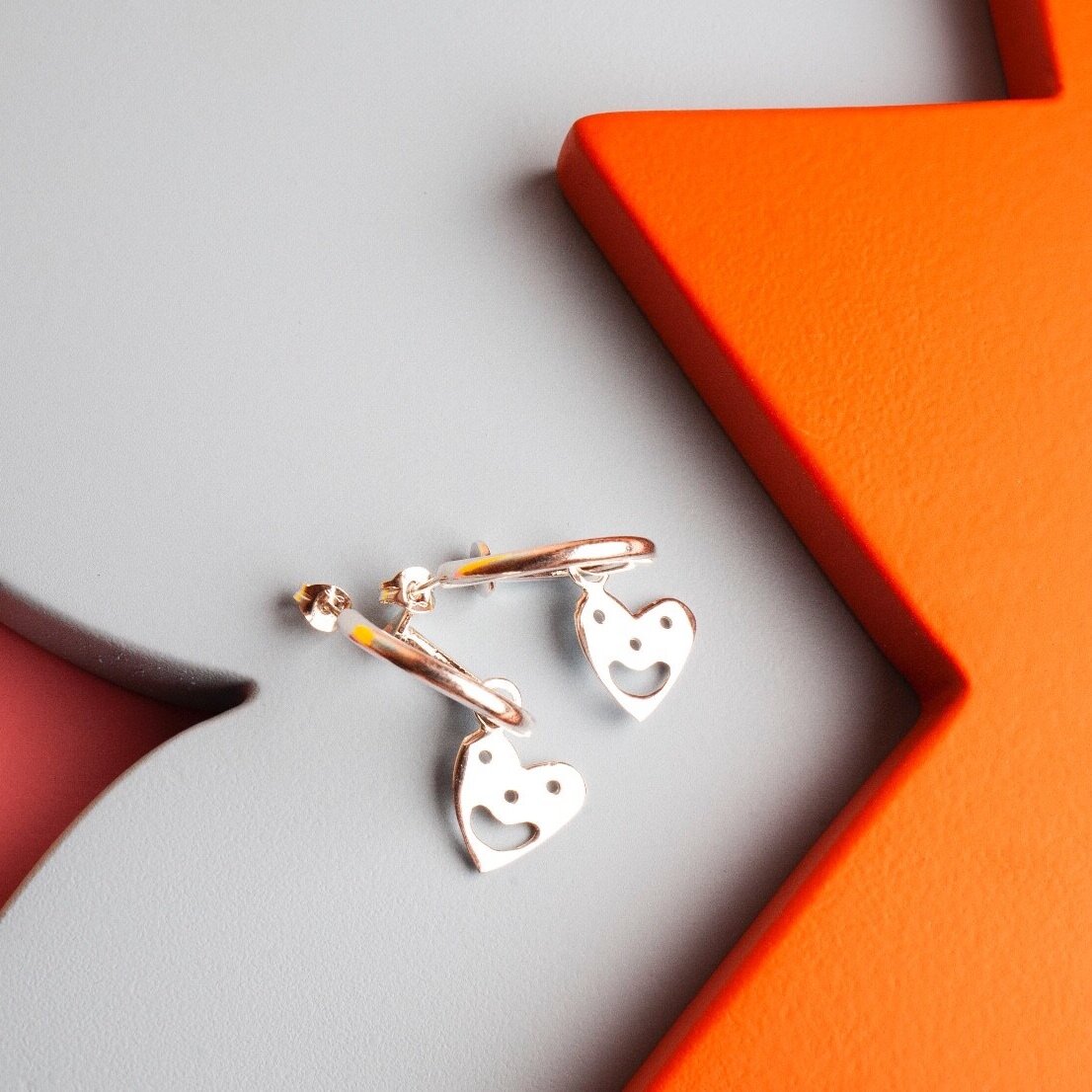 Close up of Smiley Heart Hoops earrings