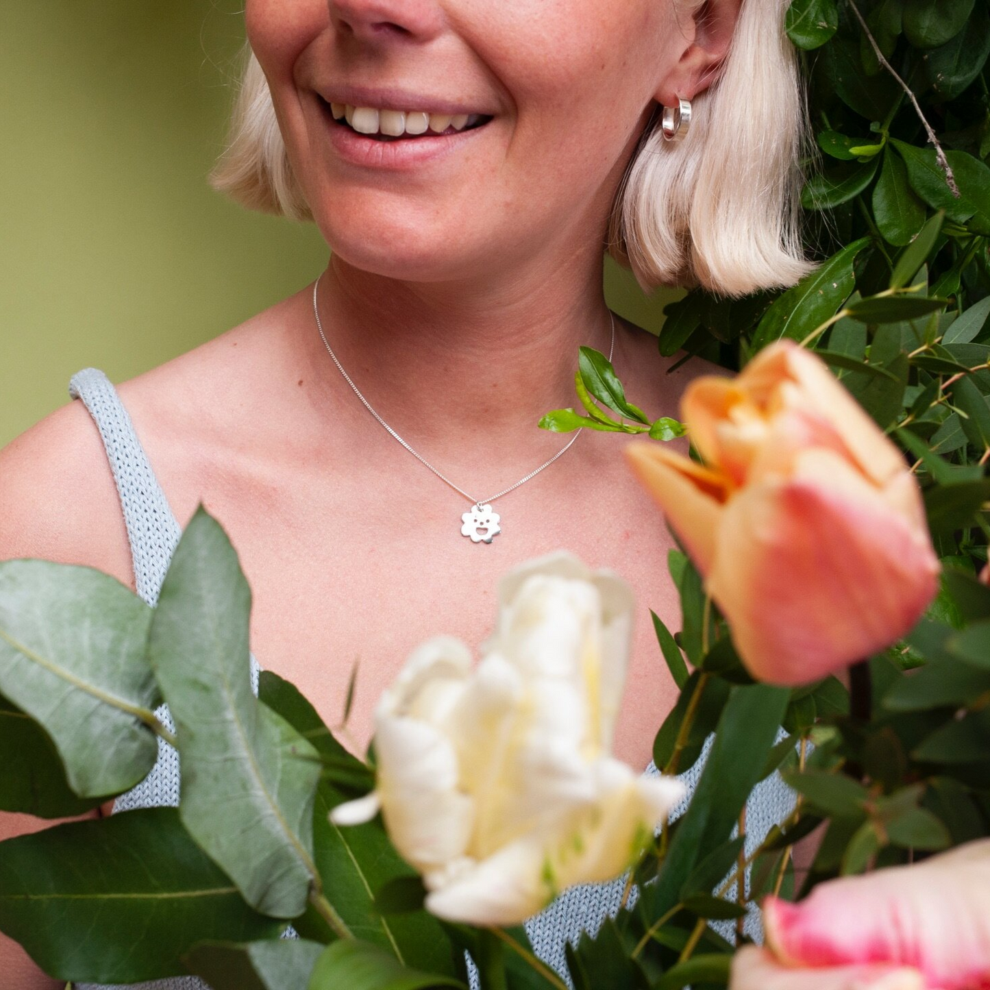 Woman wearing silver Smiley Flower Necklace