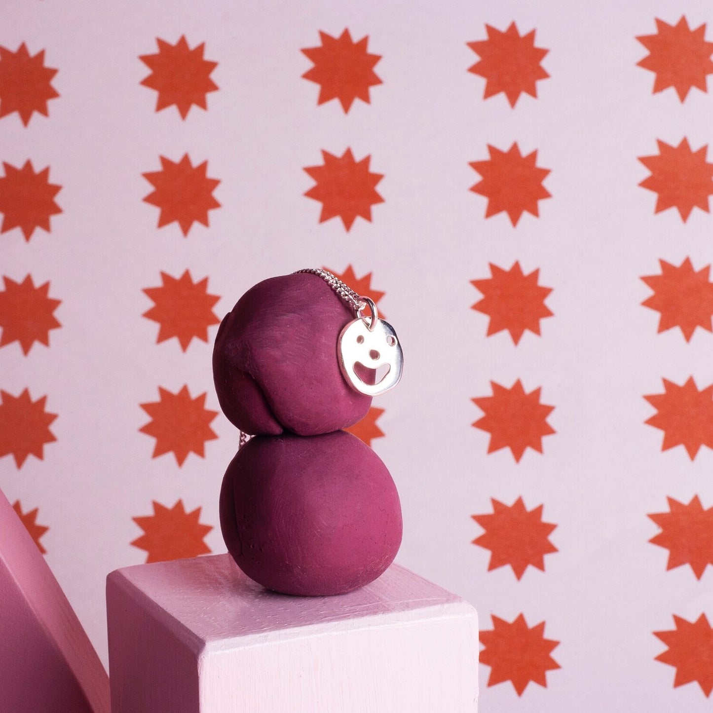 Close up of silver Smiley Necklace