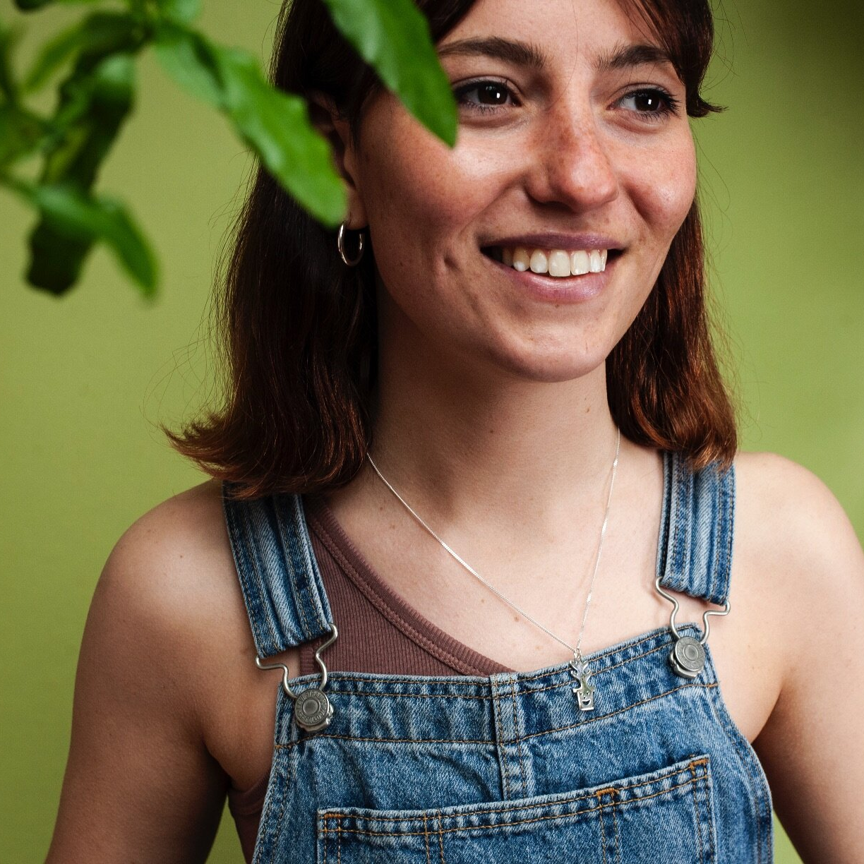 Woman wearing small gold hoop earring