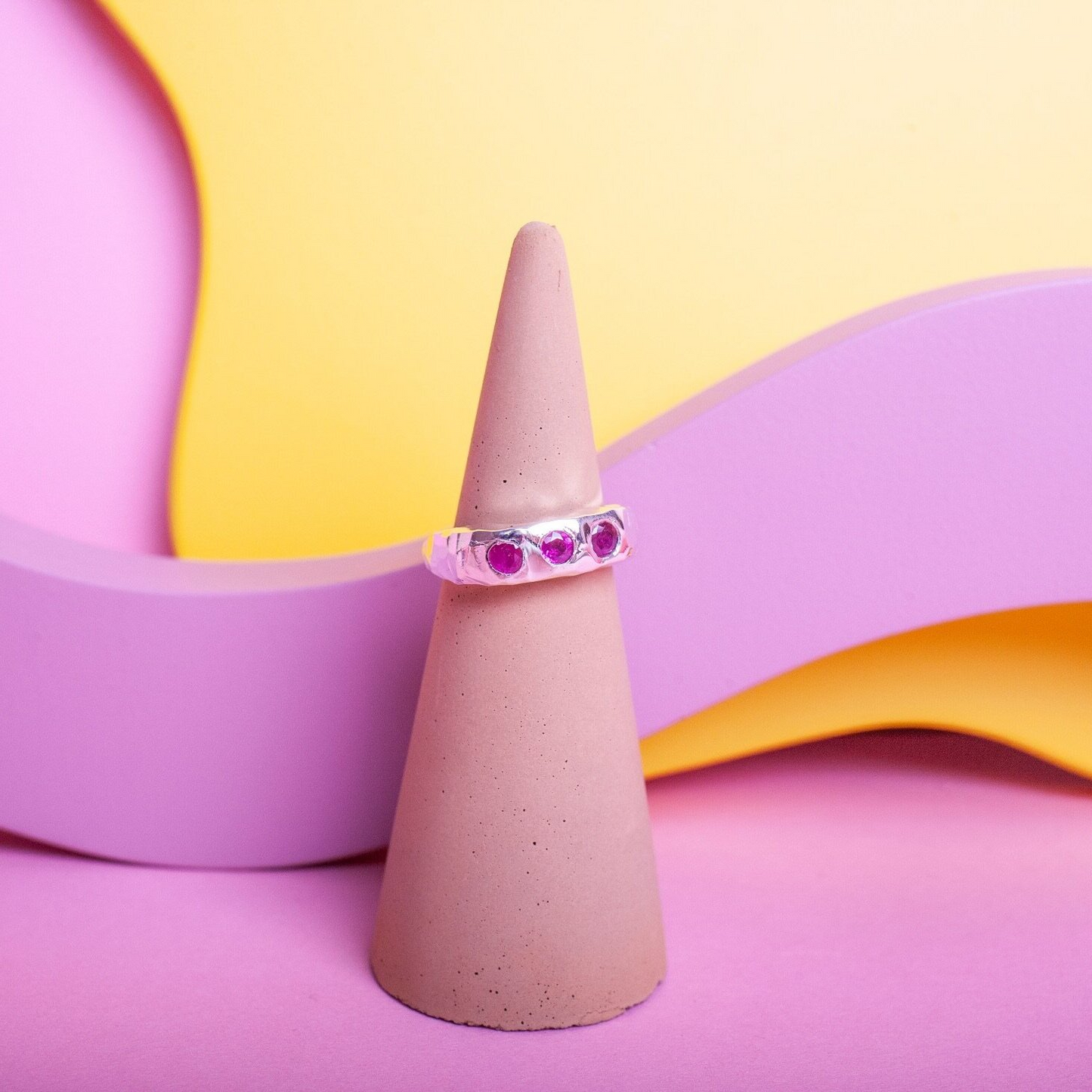 Silver ring with 3 pink gems