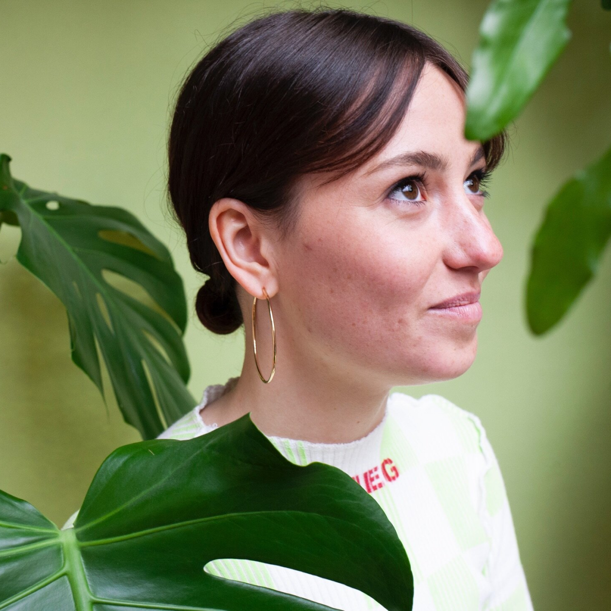 Woman wearing large gold hoop earring