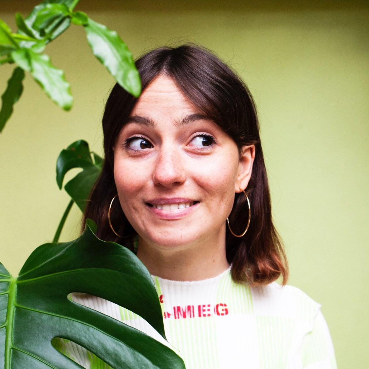 Woman wearing large gold hoop earrings