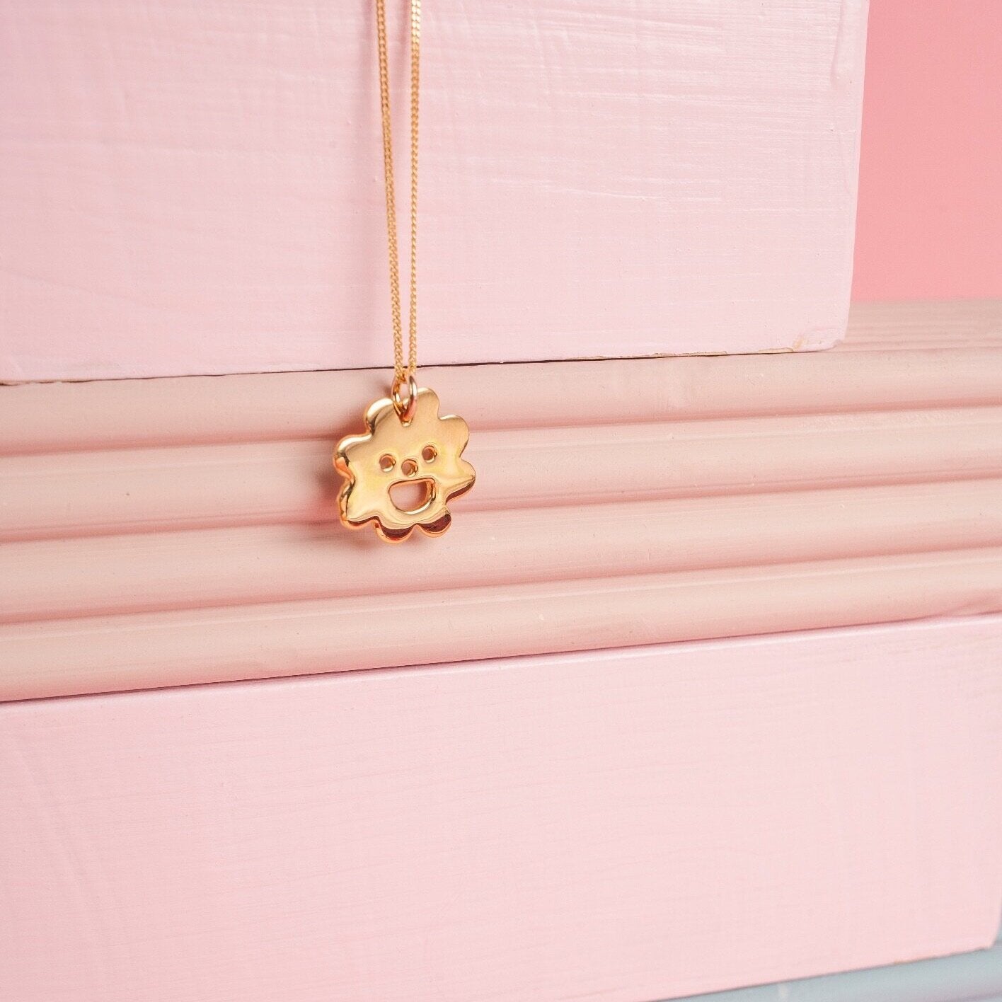 Close up of gold Smiley Flower Necklace