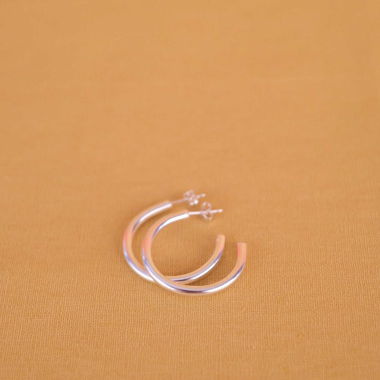 Close up of silver hoop earrings